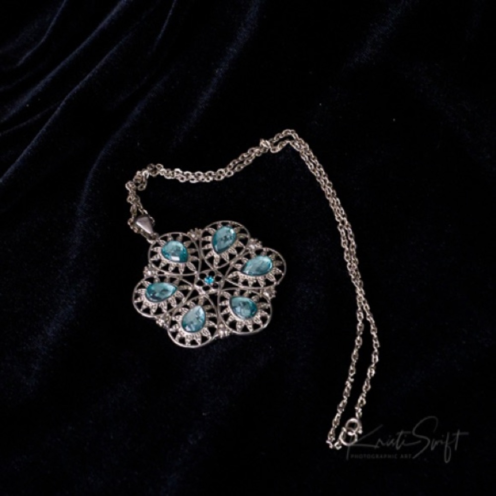 Blue glass faceted gem pendant